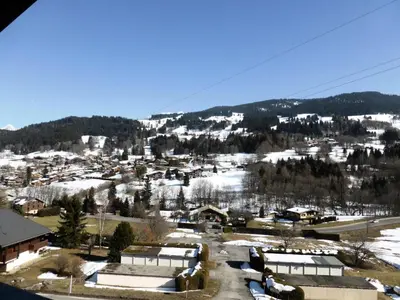 a small town with snow on a mountain at Résidence Princesse En Etraz Narcisse - Princesse en Etraz N34 MAE-2284 in Combloux