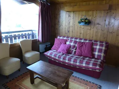 a living room with a couch and a table at Résidence Princesse En Etraz Narcisse - Princesse en Etraz N41 MAE-2294 in Combloux