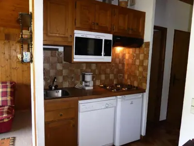 a small kitchen with a sink and a microwave at Résidence Princesse En Etraz Narcisse - Princesse en Etraz N41 MAE-2294 in Combloux