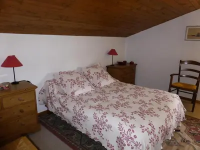a bedroom with a bed and two lamps and a chair at Résidence Princesse En Etraz Narcisse - Princesse en Etraz N41 MAE-2294 in Combloux