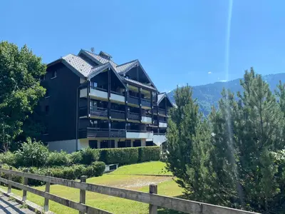 a large black building with a roof at Duplex Samoëns 4/6 couchages in Samoëns