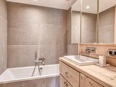 a bathroom with a white tub and a sink at Appartement 3P 6 pers. proche pistes, wifi, garage - FR-1-453-293 in Megève