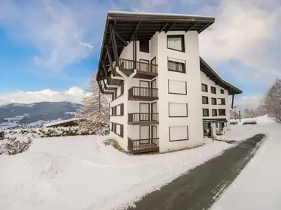 a white building with snow on the ground at Appartement 3P 6 pers. proche pistes, wifi, garage - FR-1-453-293 in Megève