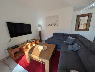 a living room with a couch and a coffee table at LE YAMA in Chamonix-Mont-Blanc
