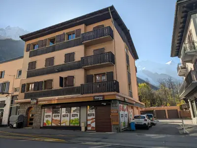 a tall building with a balcony on top of it at LE YAMA in Chamonix-Mont-Blanc