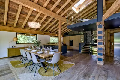 a dining room with a long table and chairs at Chalet Black Stone in Chamonix-Mont-Blanc