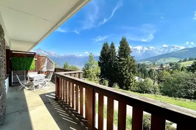 a balcony with a view of the mountains at Reflet du Mont-Blanc in Combloux