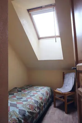 a bedroom with a bed and a skylight at Saint-Gervais apartment next to Bettex ski lift in Saint-Gervais-les-Bains