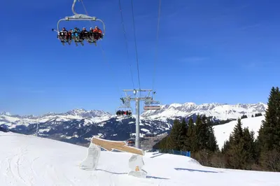 a group of people riding a ski lift in the snow at Saint-Gervais apartment next to Bettex ski lift in Saint-Gervais-les-Bains