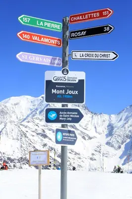 a pole with street signs on it in the snow at Saint-Gervais apartment next to Bettex ski lift in Saint-Gervais-les-Bains