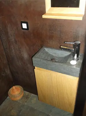 a bathroom with a sink and a mirror at Appartement Résidence Astoria in Chamonix-Mont-Blanc