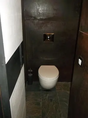 a bathroom with a white toilet in a stall at Appartement Résidence Astoria in Chamonix-Mont-Blanc