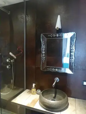 a bathroom with a sink and a mirror at Appartement Résidence Astoria in Chamonix-Mont-Blanc