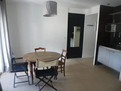 a dining room table and chairs in a kitchen at Appartement Résidence Astoria in Chamonix-Mont-Blanc