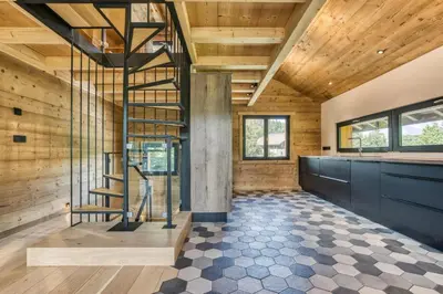 a staircase in a room with wooden walls at Megève - Chalet Yack - Premium jusqu'à 15 pers in Megève