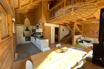 a room with a table and a window with a pot on it at Semi Detached Chalet For 8 With Balcony & Garden in Chamonix-Mont-Blanc