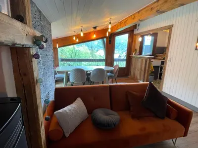 a living room with a couch and a table at Appartement en plein centre du village (6-8 personnes) in Les Contamines-Montjoie