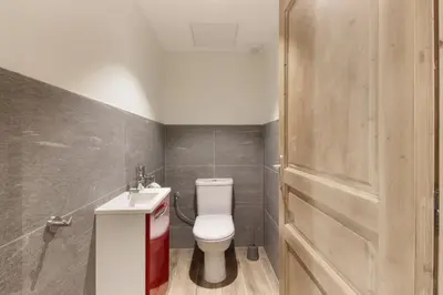 a bathroom with a toilet and a sink at L'Abeille - Renovated - 4 bedroom - 8 person-110sqm - Views! in Les Houches