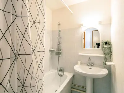 a bathroom with a sink and a toilet and a bath tub at Apartment Le Martagon 007 by Interhome in Saint-Gervais-les-Bains