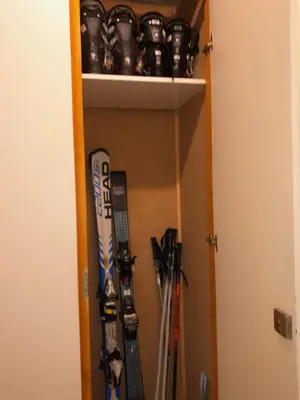 a shelf with skis and other ski equipment in a room at L'enclaves in Les Contamines-Montjoie