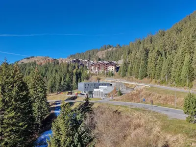 a living room with couches and a table at Appartement spacieux avec sauna et grande terrasse, pour 10 pers. - FR-1-425-118 in Flaine