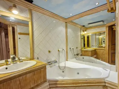 a large bathroom with a tub and a sink at Appartement spacieux avec sauna et grande terrasse, pour 10 pers. - FR-1-425-118 in Flaine