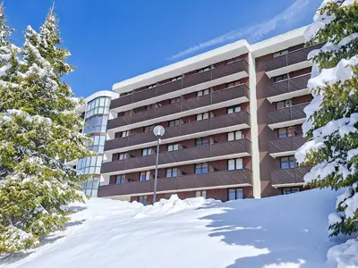 a bedroom with two beds and a window at Appartement rénové 3 pièces · Centre station · Balcon · 6 personnes - FR-1-425-126 in Flaine