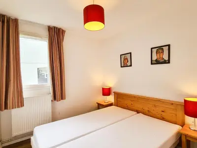 a bedroom with two beds and a window at Appartement lumineux 8 pers · Balcon · Parking en option - FR-1-425-131 in Flaine