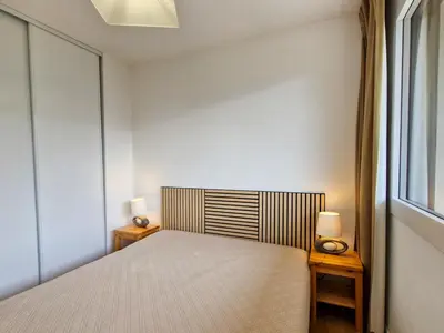 a bedroom with a bed and two night stands at Appartement 6 pers. confortable à Flaine avec balcon - FR-1-425-148 in Flaine