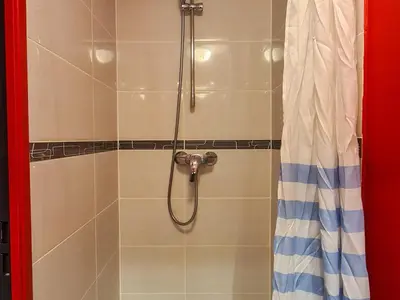 a bathroom with a shower with a shower curtain at Appartement spacieux et lumineux · 8 personnes · Balcon · Flaine Centre - FR-1-425-134 in Flaine