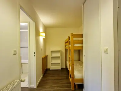 a small room with bunk beds and a hallway at Appartement lumineux avec balcon au centre station - FR-1-425-141 in Flaine