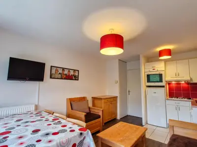 a living room with a bed and a kitchen at Appartement lumineux avec balcon au centre station - FR-1-425-141 in Flaine