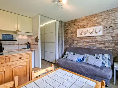 a living room with a couch and a kitchen at Studio rénové au centre de Flaine avec balcon pour 5 personnes - FR-1-425-154 in Flaine