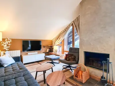 a living room with a couch and a fireplace at Appartement confortable 3 pièces à Flaine - 6 pers - FR-1-425-140 in Flaine
