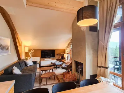 a living room with a couch and a fireplace at Appartement confortable 3 pièces à Flaine - 6 pers - FR-1-425-140 in Flaine
