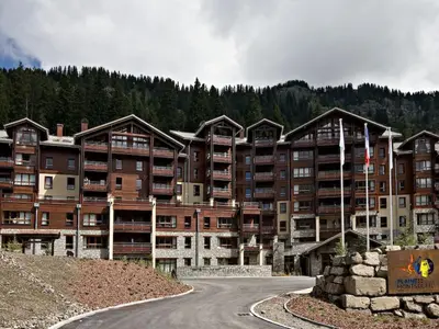 a large apartment building with a road in front of it at Appartement confortable 3 pièces à Flaine - 6 pers - FR-1-425-140 in Flaine