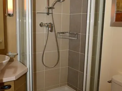a bathroom with a shower with a glass door at Appartement confortable 3 pièces à Flaine - 6 pers - FR-1-425-140 in Flaine