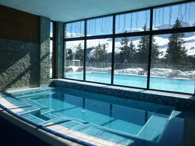 a swimming pool in a house with a large window at Appartement confortable 3 pièces à Flaine - 6 pers - FR-1-425-140 in Flaine