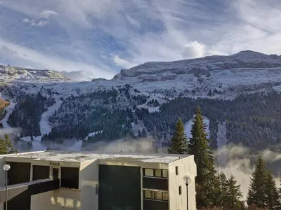 a building with a view of a mountain at Appartement confortable au centre, balcon, 6 personnes - FR-1-425-142 in Flaine