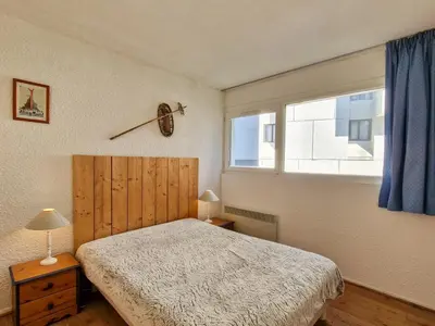 a bedroom with a bed and a window at Appartement confortable au centre, balcon, 6 personnes - FR-1-425-142 in Flaine