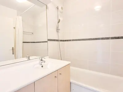 a white bathroom with a sink and a bath tub at Appartement lumineux 6 pers à Flaine avec balcon et options parking - FR-1-425-149 in Flaine
