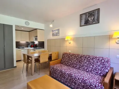 a living room with a couch and a table at Appartement Confortable 2 Pièces, Proche des Pistes, WIFI Gratuit - FR-1-425-165 in Flaine