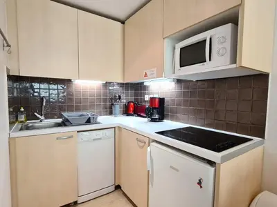 a kitchen with a sink and a microwave at Appartement Confortable 2 Pièces, Proche des Pistes, WIFI Gratuit - FR-1-425-165 in Flaine