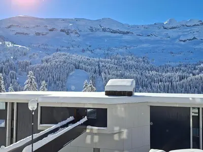 a view of a snow covered mountain from a house at Studio rénové 4 pers, proche pistes, balcon, casier ski - FR-1-425-172 in Flaine