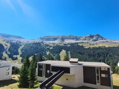 an aerial view of a house with mountains in the background at Studio rénové 4 pers, proche pistes, balcon, casier ski - FR-1-425-172 in Flaine