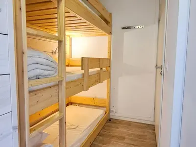 a bunk bed room with two bunk beds at Studio neuf pour 4 pers. au centre de Flaine avec balcon - FR-1-425-170 in Flaine