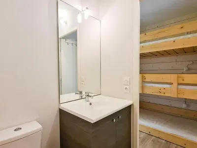 a bathroom with a sink and a mirror at Studio neuf pour 4 pers. au centre de Flaine avec balcon - FR-1-425-170 in Flaine