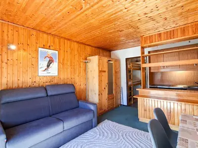 a small living room with a couch and a tv at Studio confortable à Flaine, balcon et proximité pistes - FR-1-425-180 in Flaine