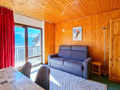 a living room with a couch and a chair at Studio confortable à Flaine, balcon et proximité pistes - FR-1-425-180 in Flaine