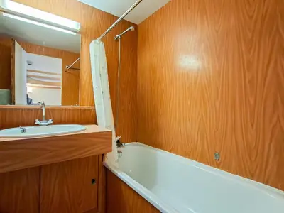 a bathroom with a white tub and a sink at Studio confortable à Flaine, balcon et proximité pistes - FR-1-425-180 in Flaine